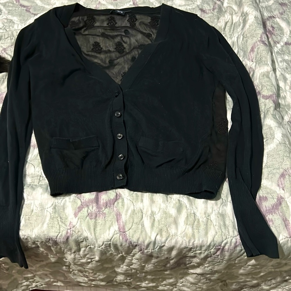 Black sweater back is see-through